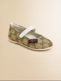 The familiar GG woven fabric in a graceful ballerina flat with sophisticated Gucci touches.Fabric upperGrip-tape close strapRubber soleSignature striped bow detailMade in Italy