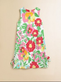 Blooming with vivid flowers and bows, this cheery, warm-weather ready shift is perfect for afternoon tea or a walk through a rose garden.JewelneckSleevelessBack zipperFront patch pocketsSide-vented hemFully linedCottonMachine washImported