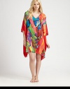 Vivid colors swirl on this flowing animal-inspired design of silky-smooth material. V-neckThree-quarter length dolman sleevesAbout 36 from shoulder to hemPolyesterMachine washImported