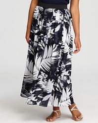 Make way for a statement monochromatic silhouette with this VINCE CAMUTO PLUS maxi skirt boasting a graphic tropical print.