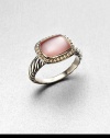 From the Noblesse Collection. A pretty pink mother-of-pearl cabochon center surrounded by a diamond accented border set in sterling silver cable shank. Pink mother-of-pearlDiamonds, .21 tcwSterling silverWidth, about .39Imported 