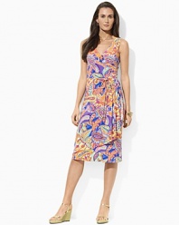 Smooth paisley jersey flatters the body in a feminine A-line silhouette with an elegant cross-wrap neckline.