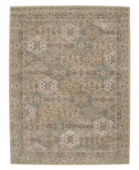 Imported from India, this magnificent rug presents a courtly style fit for today's most fashionable homes. Varying shades of green and beige are patterned in distinctive traditional design. Hand-tufted from ultra-soft 100% wool pile.