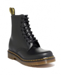 This pair of men's boots is pure Dr. Martens--funky modern boots for men crafted in quality leather, with their signature yellow topstitching and logo tag at heel. Imported.