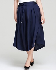 Usher in a season of ladylike elegance with this VINCE CAMUTO Plus skirt. A cascade of pleats lends elegant movement to a modest midi silhouette for a style brimming with classic femininity.