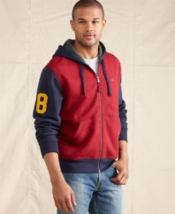 Throwback. Sport a scholastic style in this comfortable zip-up hoodie from Tommy Hilfiger.