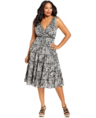 An ultra-flattering A-line shape elegantly outlines Style&co.'s sleeveless plus size dress, featuring a tiered skirt-- wear it from day to play!