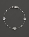 Stations of diamonds and clear quartz dot a sterling silver chain. By Ippolita.