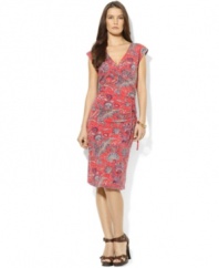 A bold, bright paisley print enlivens this petite feminine dress from Lauren by Ralph Lauren in breezy stretch jersey, tailored in a flattering faux-wrap silhouette for a chic, modern look.