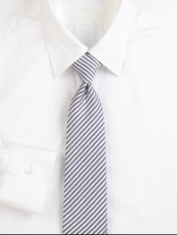 Narrow stripes lend an elegant appeal to this beautifully woven Italian silk tie. About 3 wideSilkDry cleanMade in Italy