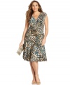 Jones New York's plus size dress is seamed to figure-flattering perfection and enlivened by a bold print. Easily dresses up with a structured clutch and shimmery shoes.
