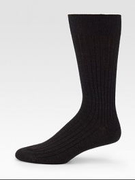 Sophisticated solid ribbed in remarkably soft, virgin merino wool.Mid-calf height80% wool/20% nylonMachine washMade in Italy