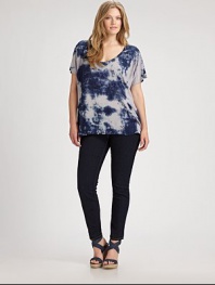 This tie-dye top might just be your new go-to style. It features an alluring v-neckline and a laid-back fit. Straight-leg jeans or skinnies would really complement this design.Deep v-neckShort sleevesRelaxed fitPull-on styleAbout 28 from shoulder to hemRayonMachine washMade in USA