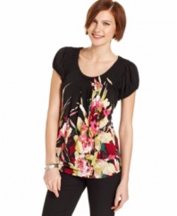 Style&co.'s petite top has pretty features like a bright floral print and pleating at the neckline. So easy to pair with everything from cropped skinny pants to jeans!