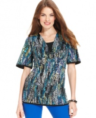 A unique graphic print, contrasting trim at the sleeves and hem and a ring detail make this petite top from JM Collection stand out from the crowd! Pair it with your favorite jeans or pants for a complete ensemble.