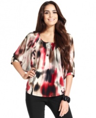 Style&co.'s petite blouse features an alluring graphic-print and a breezy fabric that is flattering on all figures!