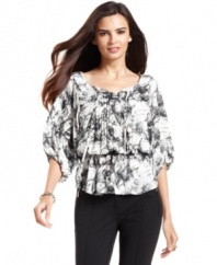 A trendy peplum waist, delicate dolman sleeves and a stunning print create a charming petite top from Style&co. Pair with skinny jeans for a fashion-forward ensemble!
