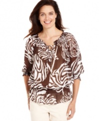 Jones New York Signature's printed peasant petite top is a classic for day or night. The sheer printed fabric gives it a touch of sophistication, while the easy silhouette is essential for the season.