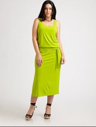 If you are looking for a design that represents comfort and style, you have found it. Made from a soft fabrication and featuring a self-tie detail at its elasticized waist, this dress is a must.ScoopneckSleevelessSelf-tie belt at elasticized waistSide slitsAbout 38 from natural waist94% polyester/6% spandexMachine washImported