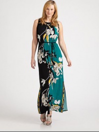 A brilliant floral print in muted hues gives this maxi dress with a waist-defining, self-tie belt a simply elegant look. You will certainly turn heads in this ultra-flattering design.Round necklineSleevelessSelf-tie beltButton closure at keyhole backAbout 43 from natural waist95% polyester/5% elastaneMachine washImported