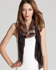 A large check pattern and earthy tones make this lightweight scarf a must-have this spring.