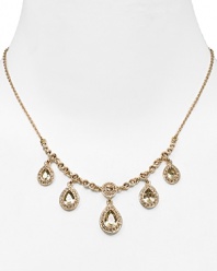 Dress up a simple look or go all out and sparkly with this gleaming drop necklace from Carolee. This piece features crystal-adorned teardrops for a notice-me neckline.