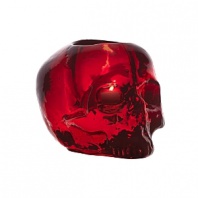 Designed by Ludvig Lofgren, this well-crafted glass skull makes a unique votive and its red color shimmers under the flicker of a candle.