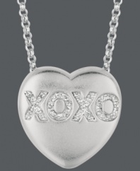Say it from the heart. Sweethearts' adorable heart-shaped pendant expresses more that just great style with the letters XOXO written in round-cut diamonds (1/10 ct. t.w.) across the surface. Pendant crafted in sterling silver. Copyright © 2011 New England Confectionery Company. Approximate length: 16 inches + 2-inch extender. Approximate drop: 5/8 inch.
