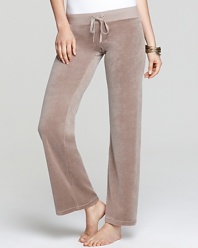 Ease into the season with classic Juicy Couture terry pants, perfect for weekend lounging or layering over swimsuits for effortless summer style.
