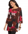 Fringed cuffs add flair to Alfani's three-quarter sleeve petite tunic top, showcasing an abstract print. (Clearance)