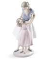 Like mother, like daughter. A lovely duo in beautifully painted porcelain, this Lladro figurine is a heartwarming memento for any family.