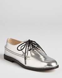 KORS Michael Kors gets edgy with the metallic Cornfield loafers, trimmed in a decorative zipper trim for downtown-cool.