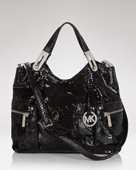 Practical and undeniable luxurious, this tote from MICHAEL Michael Kors is the ultimate daytime bag. Crafted from glossy patent leather with faux snakeskin accents, it's a wild way to carry on.
