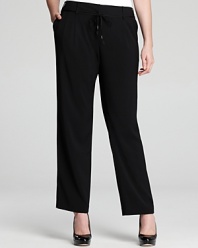 Sleek tailoring lends a slimming finish to these Tahari Woman Plus pants. Lengthen the streamlined silhouette with pointy-toe pumps and rise to new heights of office chic.