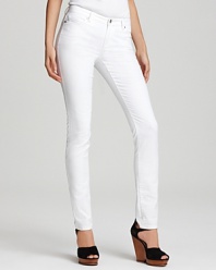 Gleaming silver-toned signature accents enhance the crisp white hue of these MICHAEL Michael Kors jeans, cut in a slim silhouette for an all-around on-trend look.