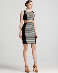 Make an impact in this Calvin Klein sheath dress, boasting graphic stripes and dramatic color blocking for a striking silhouette.