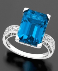 Turn heads with this brilliant ring featuring emerald-cut blue topaz (8-9/10 ct. t.w.) and round-cut diamond (1/8 ct. t.w.) set in 14k white gold.