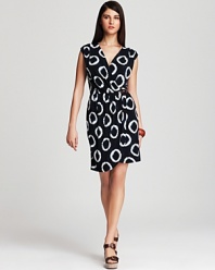 Lend an optic-pop to your off-duty look with this MICHAEL Michael Kors Petites dress, boasting a faux-wrap silhouette for an effortless hourglass figure.