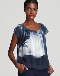 A sheer silhouette and a dark palette infuse this VINCE CAMUTO top with dramatic edge.