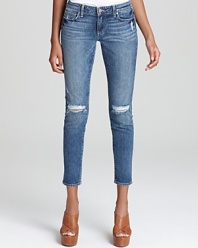 Allover fading with distressed details lends an authentic vintage patina to these Paige Denim skinny jeans, cropped at the ankles for a fresh silhouette.