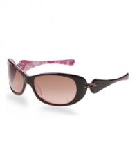 Organically Rounded, voluptuous contours and a smooth, sleek finish heighten the feminine allure of this design. This sporty yet conservative style fuses classic and retro design enhanced by authentic Oakley metal icons on an acetate frame. The inside of the eye wear stems features the breast cancer awareness pink ribbon design to make this style completely unique. It struts on the beach and the streets, begging onlookers to take notice.