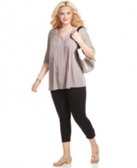 Prettify your look with Style&co.'s three-quarter sleeve plus size top, finished by a pleated front.