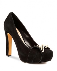 VINCE CAMUTO's Jamma platforms are not-so-sweet--a girlish bow is toughened up with spiked gold-tone studs.