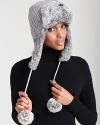 A cute and cozy knit aviator hat that features dyed fur ears, pom-pon ties and a flip-up brim.