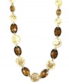 Jones New York's chic collar necklace is distinctively decorated with smokey quartz-colored stones, as well as round disc accents. Crafted in gold tone mixed metal. Approximate length: 17 inches.