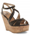 Slender criss cross straps on G by Guess's Tenor platforms add intrigue to a classic wedge silhouette.