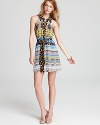 A vibrant tribal print mix and matches with a dot and jack pattern on this boho-chic Plenty by Tracy Reese shirt dress.