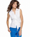 This crisp cotton top, featuring eyelet embroidery, is a summer must-have from Jones New York Signature. The ribbon tie at the waist gives it a feminine touch -- perfect with vibrant shorts!