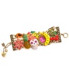 Isn't she charming? Betsey Johnson combines a white skull with fruit accents, including pineapple, yellow bananas, red cherries, orange papaya, and red flowers. A purple and green snake and colorful crystal accents top it all off. Setting and toggle clasp crafted in antique gold-plated mixed metal. Approximate length: 7-1/2 inches.
