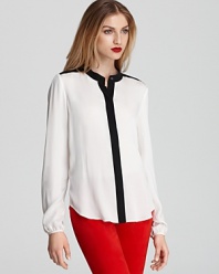 Opt for Parisian-inspired chic in this black-and-white Theory top, perfectly crafted in luxe silk.